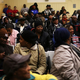 People wait for free Thanksgiving groceries at a community center in Harlem. (Spencer Platt/Getty Images)